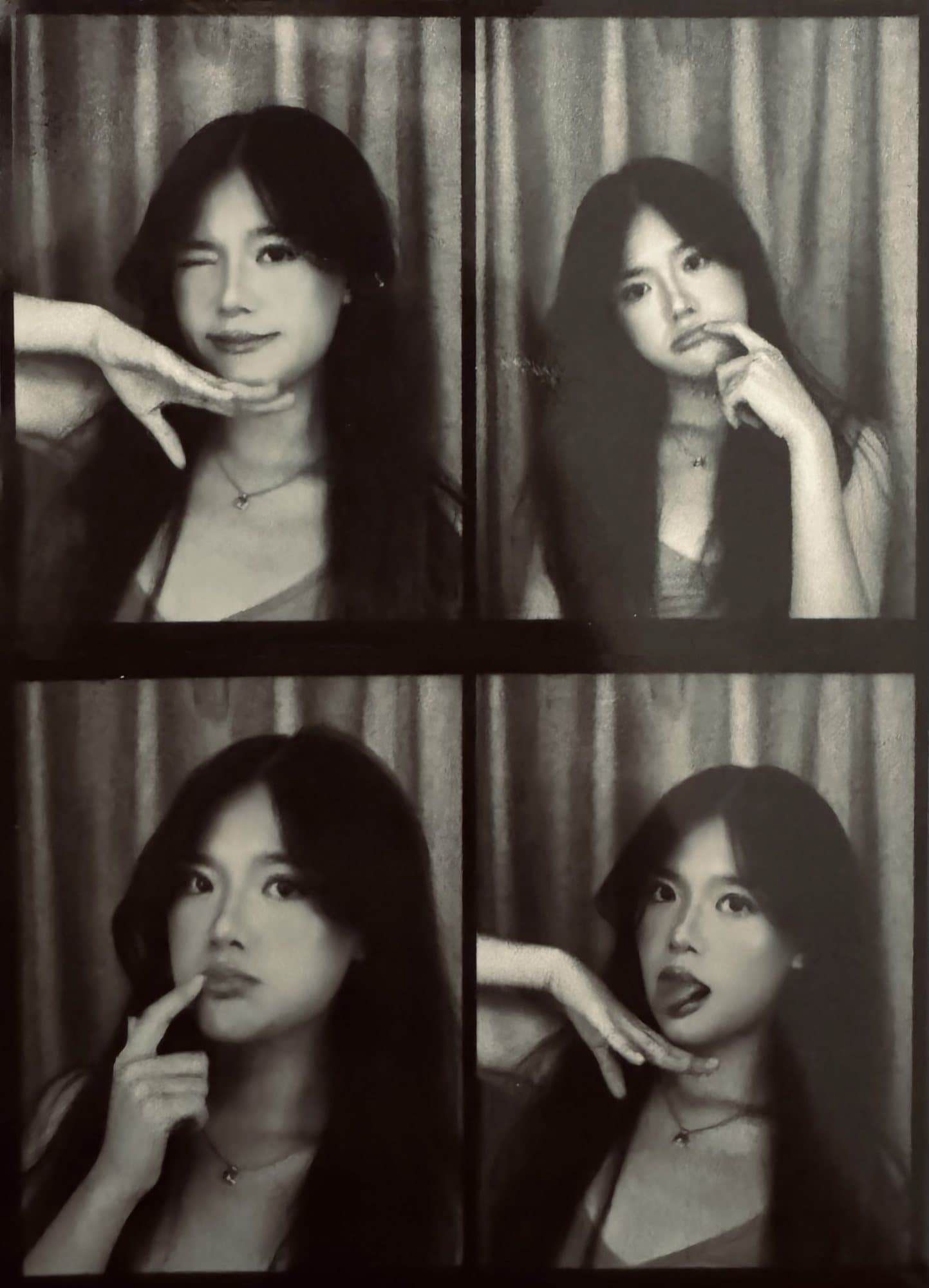 Black and white photo booth strip of four poses, taken in New York City