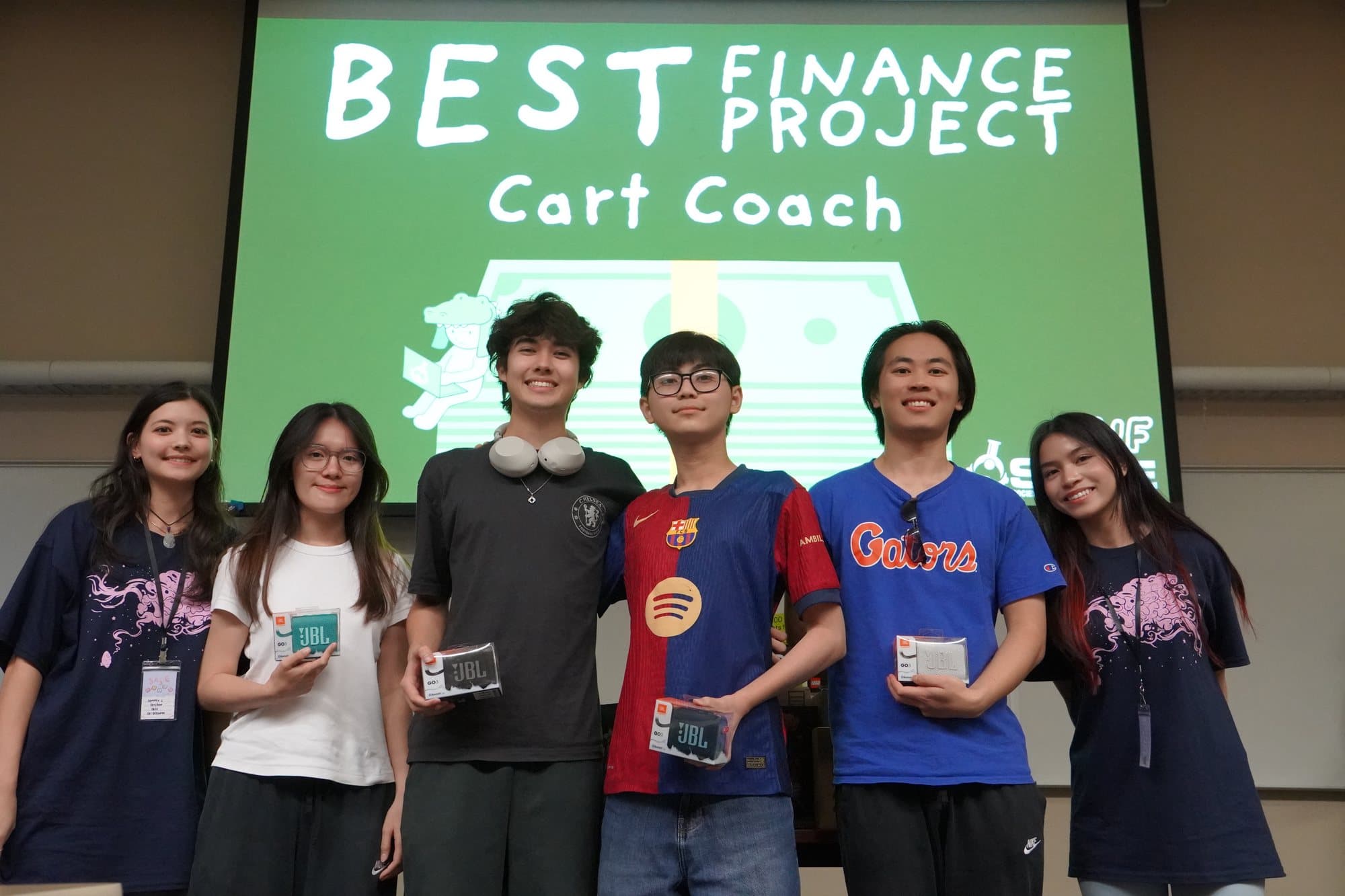 The CartCoach team holding the Best Finance Project sign